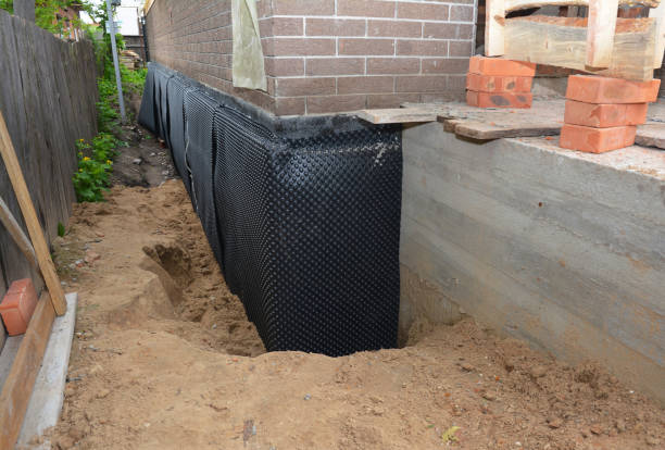 Happy homeowners after waterproofing job in Knowlesville